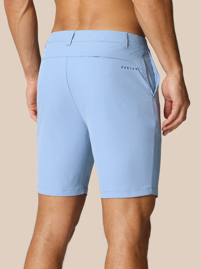 Back view of sky blue golf shorts showing back pocket and Castore branding.