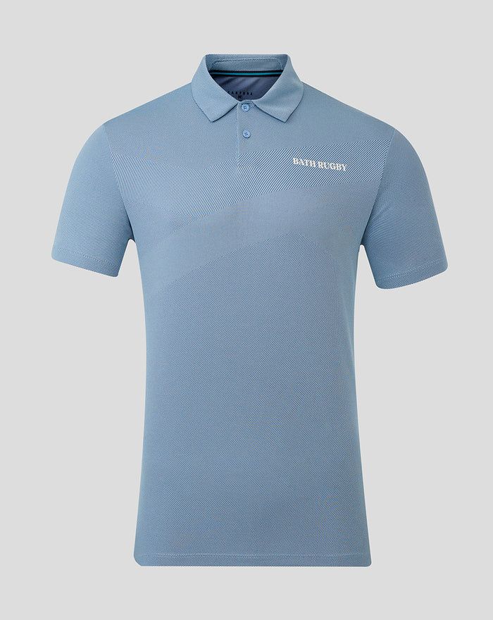 Front view of sky blue engineered knit golf polo with diagonal color panels and textured pattern