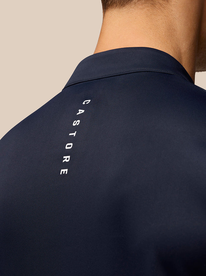 Close-up of midnight navy Golf Club Classic 1/4 Zip Top back with vertical Castore branding.