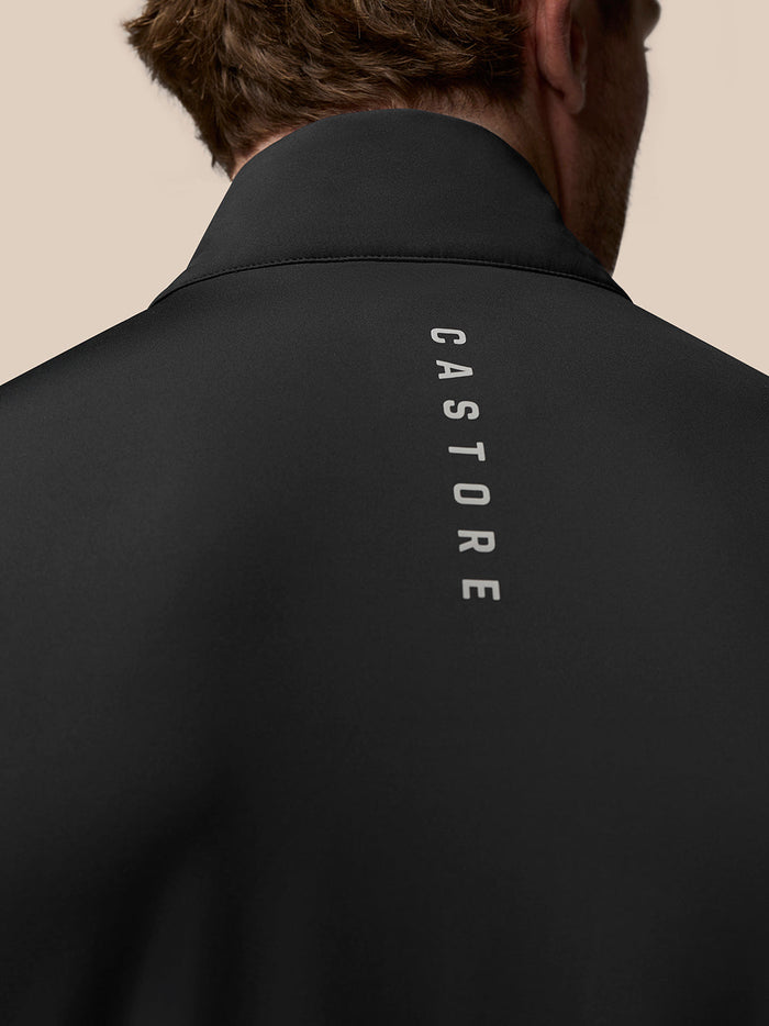 Back view of black Golf Pinnacle Gilet with vertical CASTORE branding along the upper back