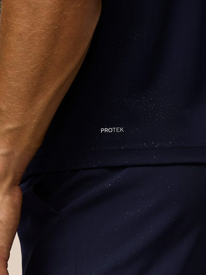 Close up of navy Pinnacle Gilet with Protek branding visible on the lower back area.