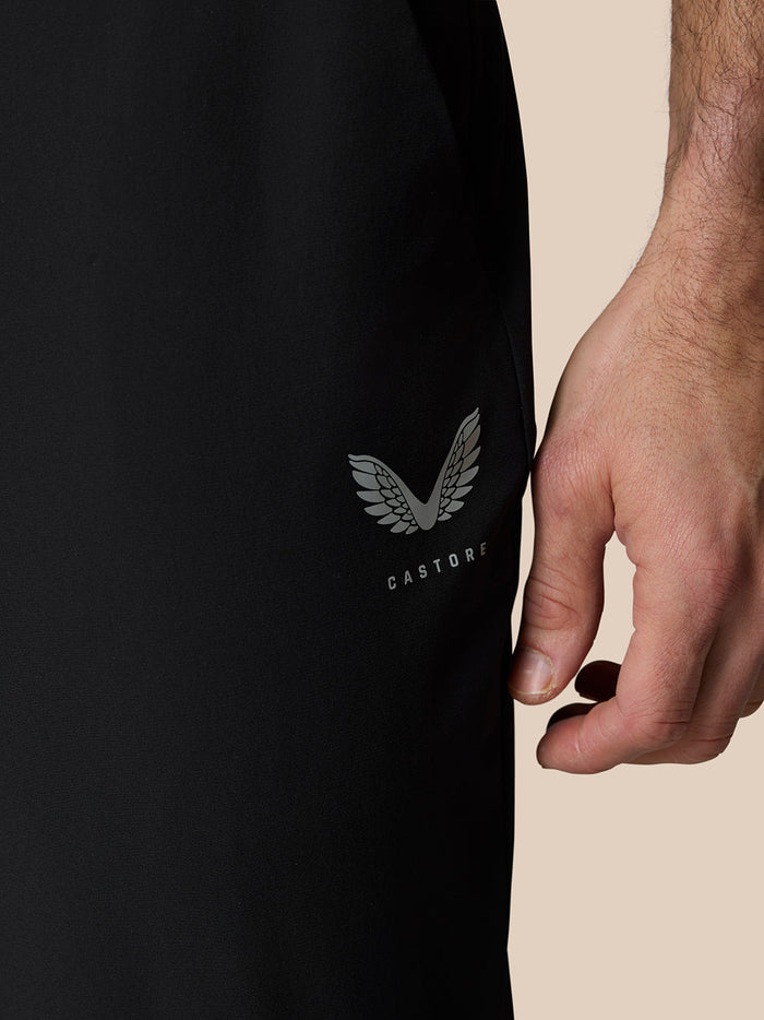 ProTek water resistant fabric close-up on black golf trousers with water droplets.