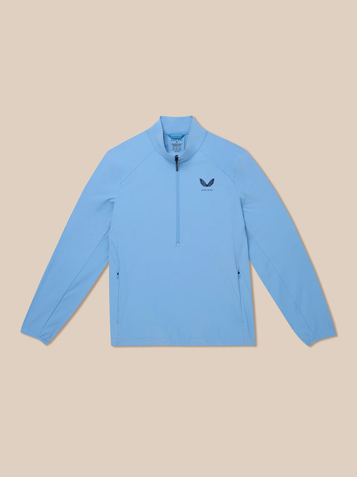 Front view of sky blue Golf Flex Woven Half Zip jacket with stand collar and chest logo