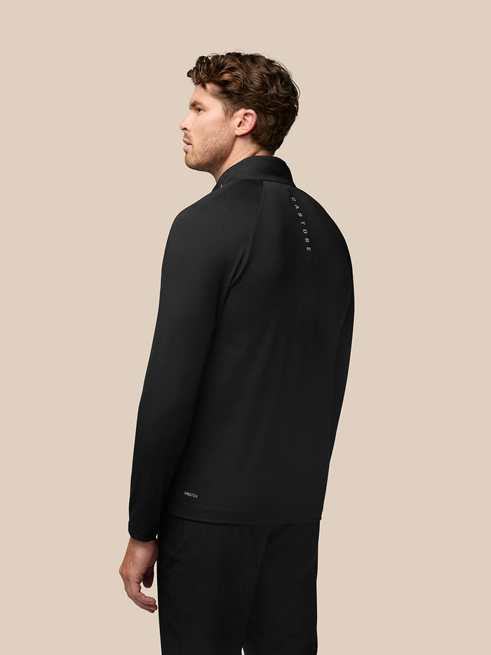 Back view of black Pinnacle Golf Jacket with Castore branding along the upper back.