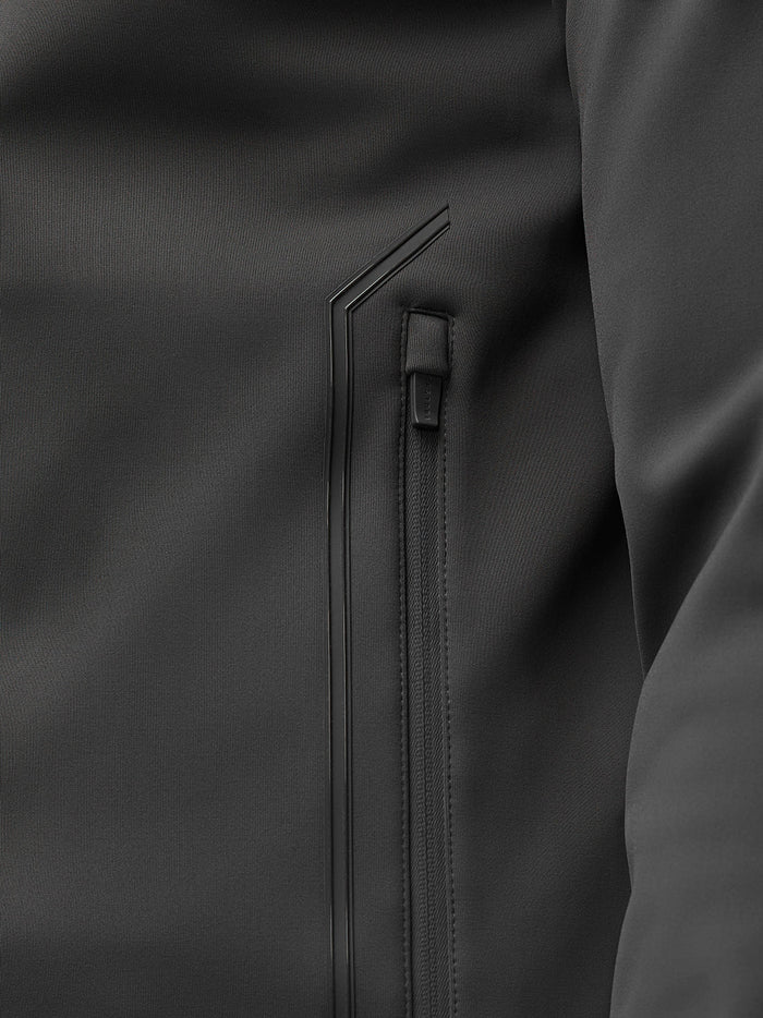 Close-up of the water resistant zip pocket and sleek seam details on the Garcia Hybrid Jacket.