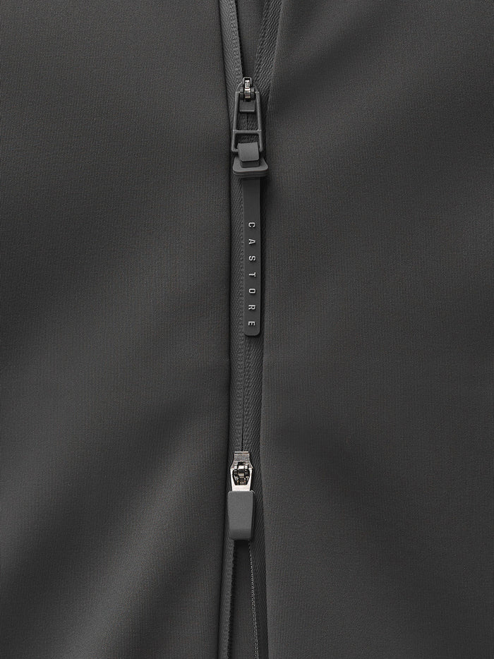 Vertical Castore branded zipper pull on dark Garcia Hybrid Jacket fabric.