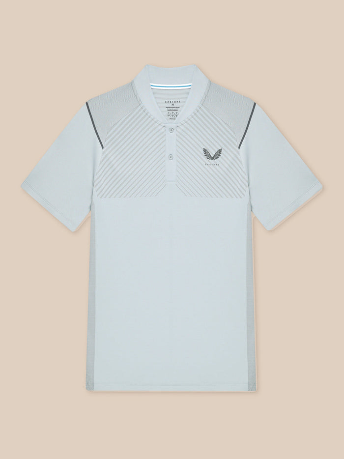 Front view of light grey Pinnacle LVS Polo showing diagonal chest ventilation pattern and Castore logo