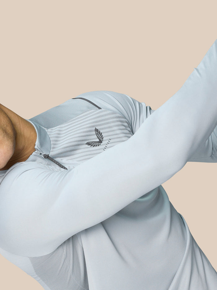 Close-up of the Pinnacle LVS 1/4 Zip Top in mid grey on a golfer highlighting the chest pattern and zip detail.
