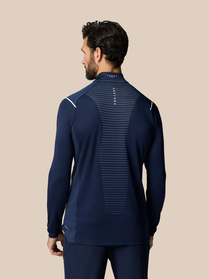 Back view of navy Pinnacle LVS 1/4 Zip Top showing central vent stripe and Castore branding at the collar
