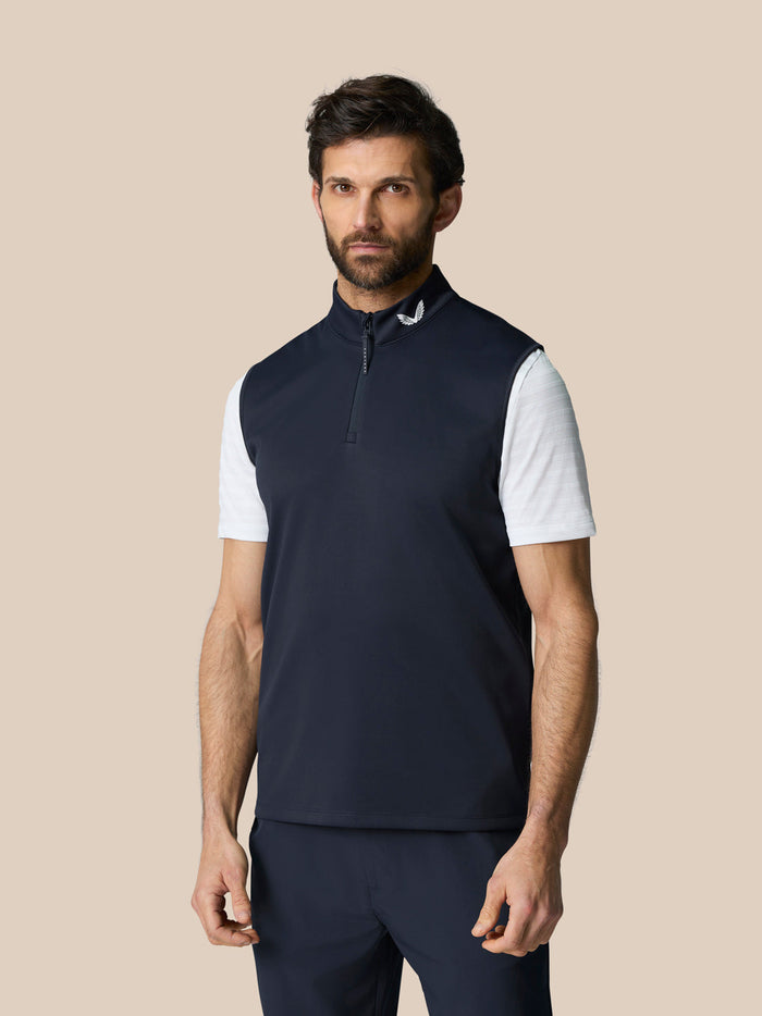 Male model wearing navy Club 1/2 Zip Gilet with high neck and sleeveless design