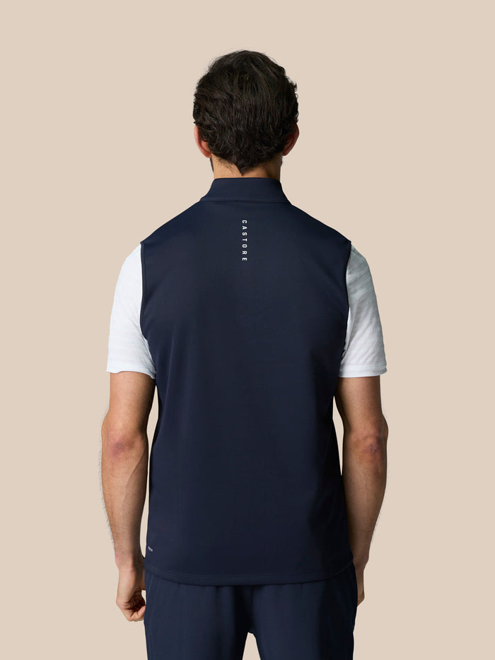 Back view of navy Club 1/2 Zip Gilet showing Castore graphic along the upper back