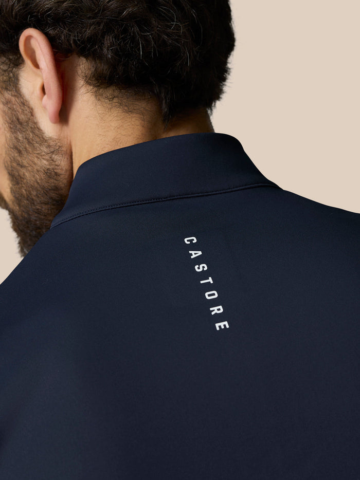 Back view of navy gilet with vertical CASTORE branding along the neck