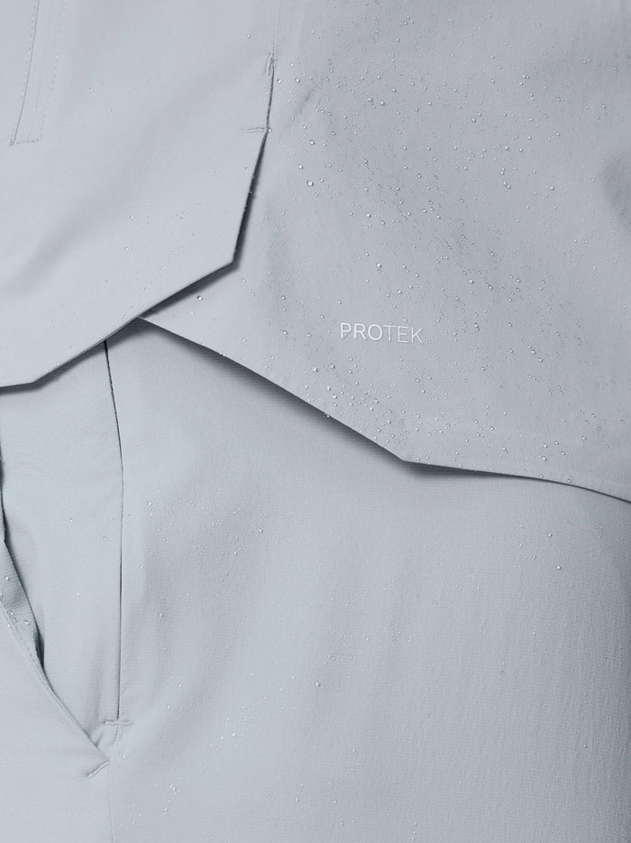 Close up of water droplets on ProTek water resistant fabric of the Golf Pinnacle LVS Woven Jacket