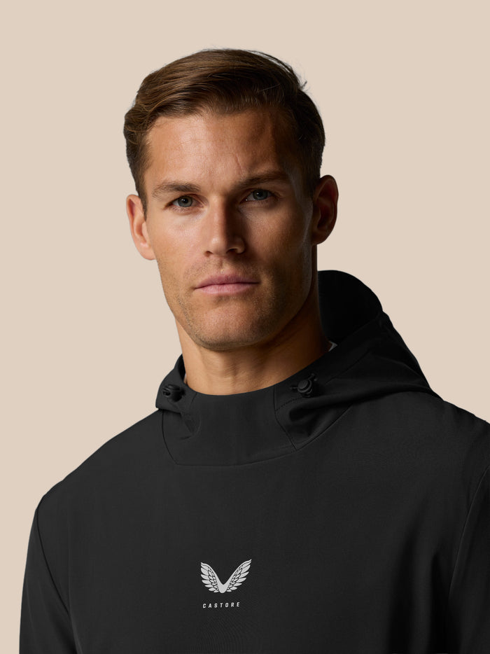 Close-up of the black Golf Pinnacle Hoodie chest featuring the Castore wing logo