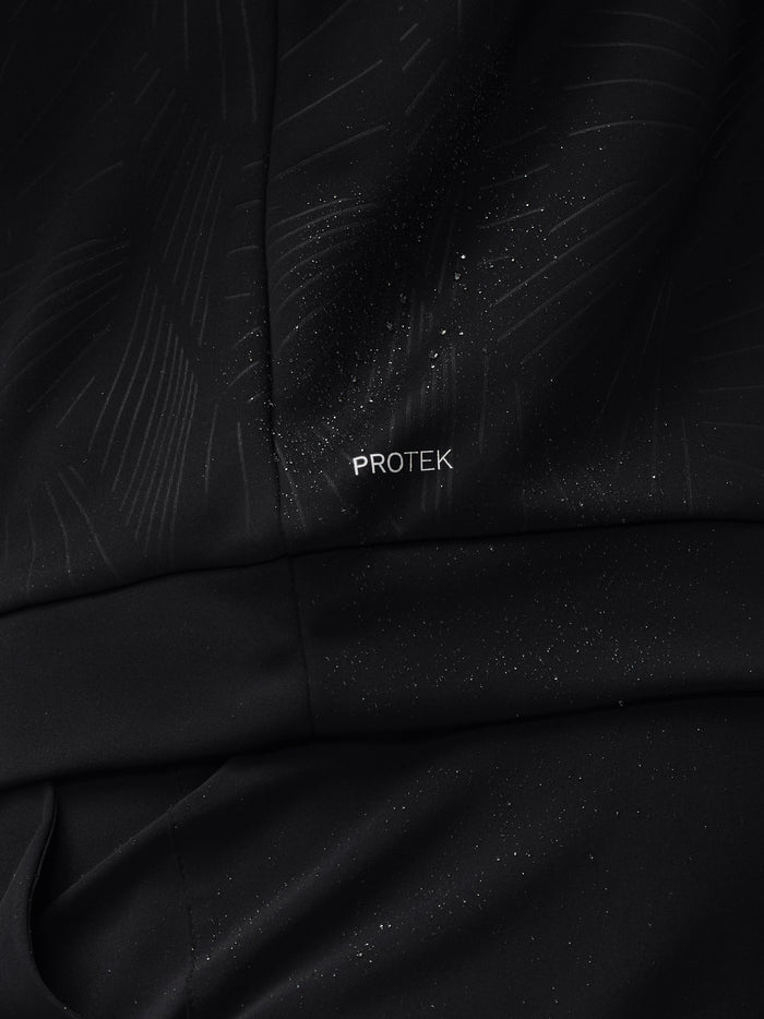 Close-up of black Golf Club Classic Quarter Zip fabric with ProTek watermark and subtle pattern