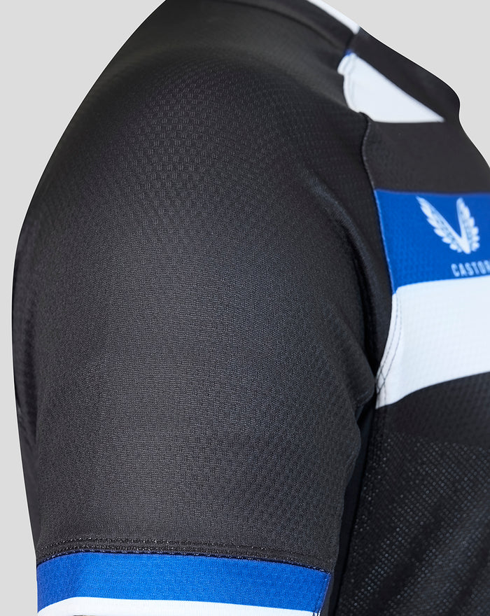 Close up of Bath Rugby 2026/27 home pro shirt shoulder showing black fabric with blue trim
