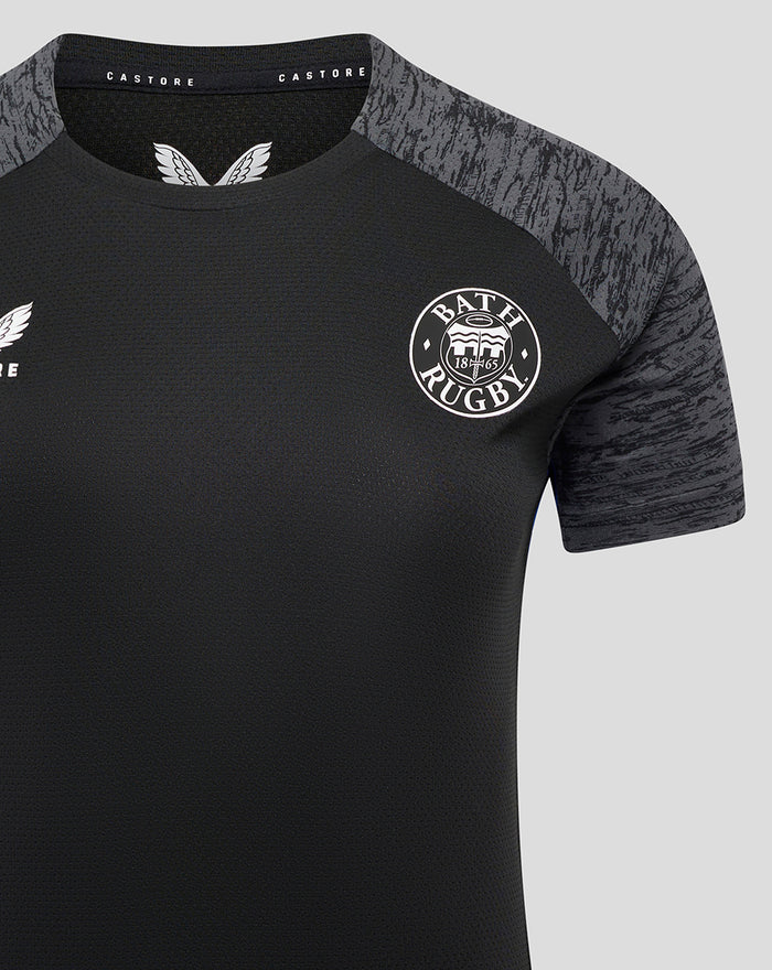 Close-up of a women's Bath Rugby training tee showing black body grey marled sleeves and club crest