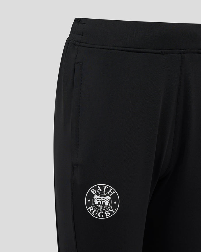Lower leg close up of black Bath Rugby pant showing a side stripe and Bath Rugby circular logo.