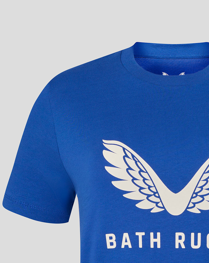 Close-up of a blue T-shirt showing a large white wing emblem on the chest.
