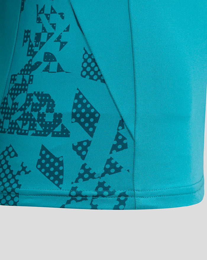 Close up of abstract geometric print on the side panel of the storm blue England Rugby performance midlayer top.