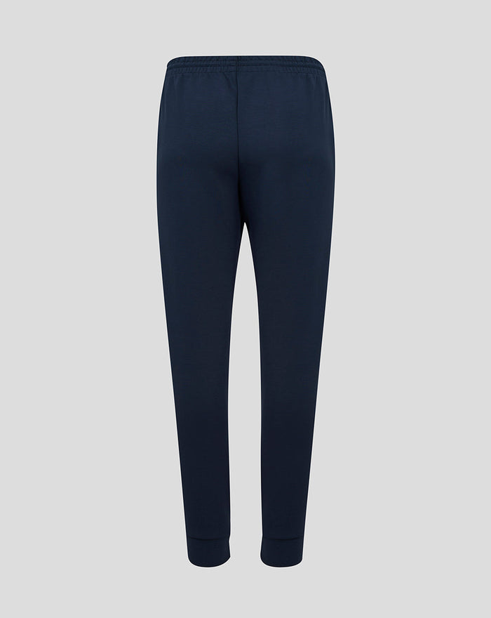Back view of navy travel knit pant with elastic waistband and clean silhouette.