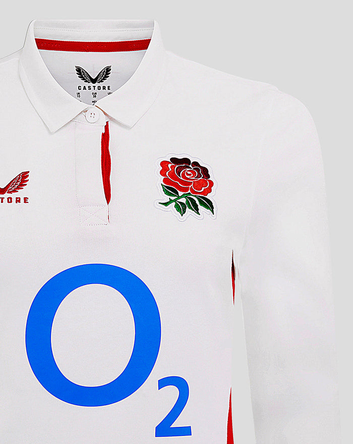Close-up of white shirt front showing rose crest on left chest and large blue O2 sponsor, part of the England Rugby Home Classic design