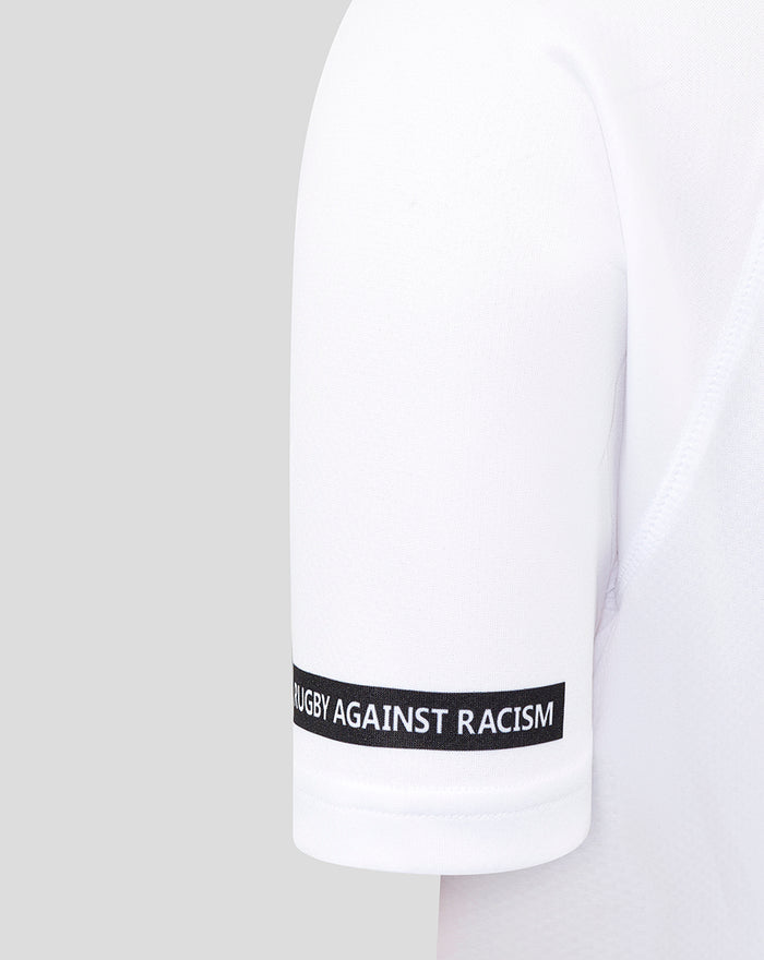 White junior away shirt sleeve with a rugby against racism black band around the cuff