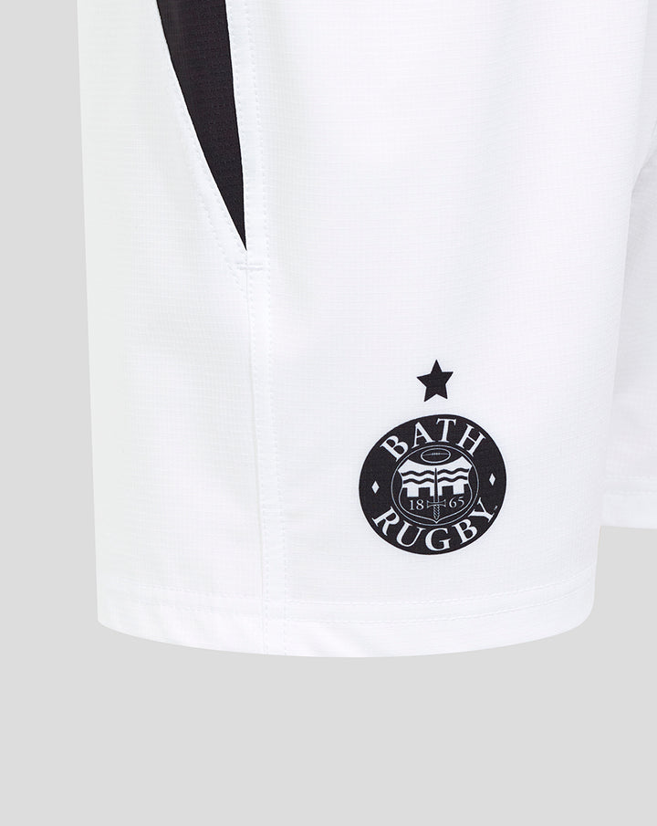 Close up of white Bath Rugby shorts featuring the Bath Rugby crest and a star above it.