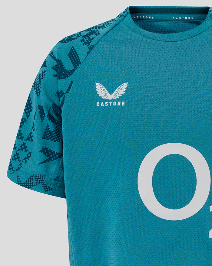 Close-up of storm blue junior England rugby tee showing center O2 logo and side panel print.