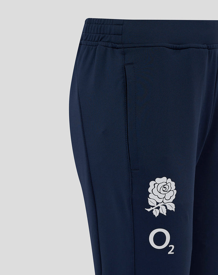 Close up of the thigh area on navy knit pants showing the rose crest and O2 logo