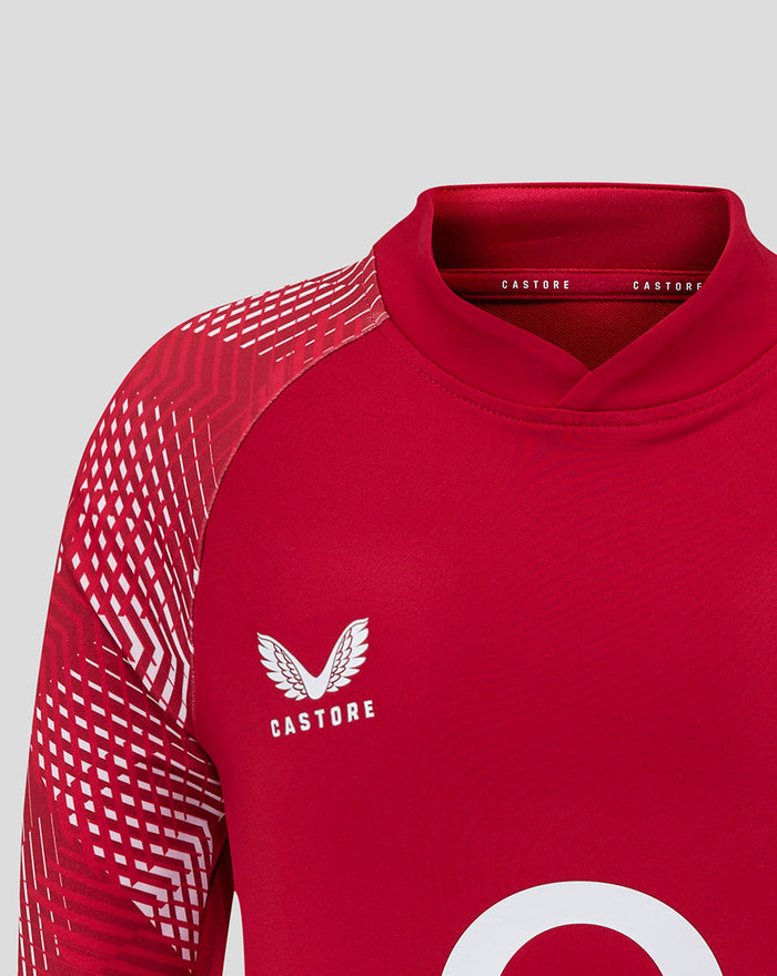 Close up of collar area on England Rugby junior drill top with Castore branding and partial rose crest on the chest