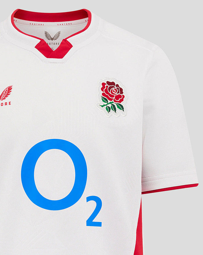 Front view of white Junior England Rugby Home Shirt with rose crest on chest, Castore branding and large O2 logo