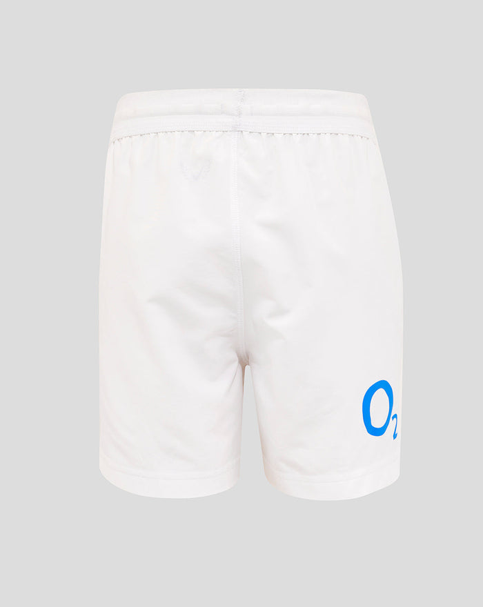 Back view of white junior England rugby home shorts with blue O2 logo on the back right thigh and Castore crest on the left thigh