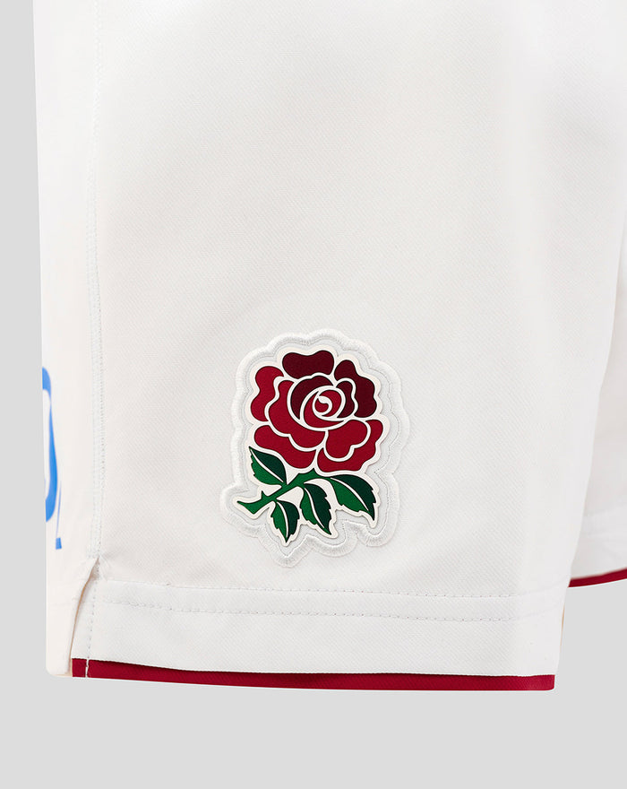 Close-up of white Junior England Rugby Home Shorts with a rose crest patch on the leg.