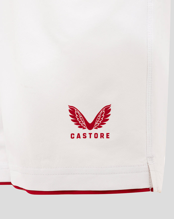 White Junior England Rugby Home Shorts hem with Castore crest and red trim.