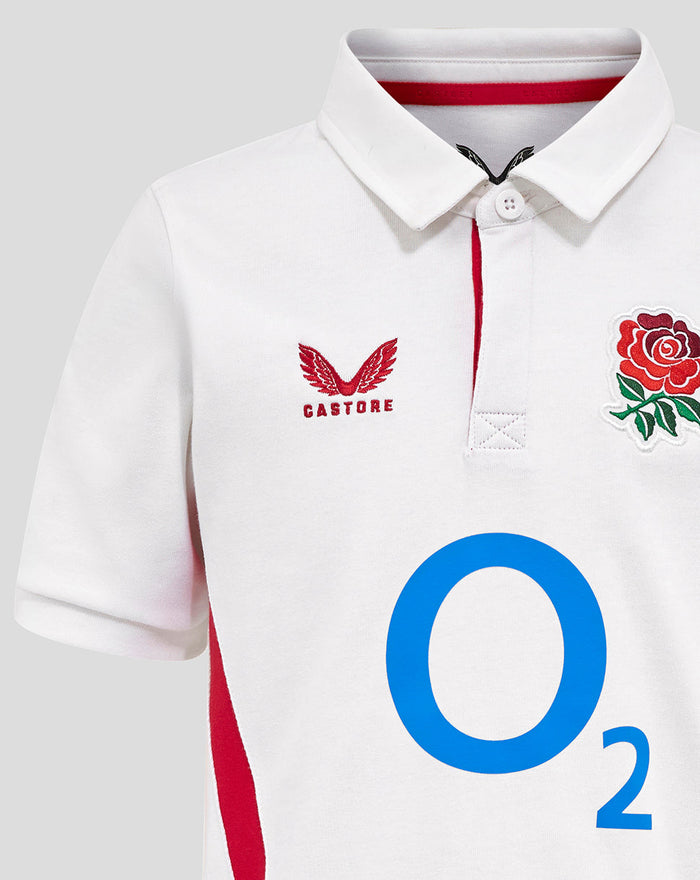 Close-up of white junior England rugby shirt with pointed collar left chest rose crest center O2 logo and Castore on right chest.