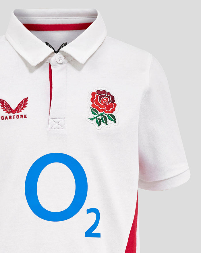 Front view of white junior England rugby shirt with rose crest on right chest Castore left chest and bold O2 logo at center.
