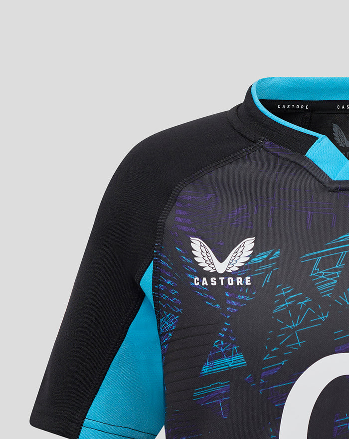 Close-up of chest area showing the rose crest and Castore logo on the dark jersey with turquoise trim.
