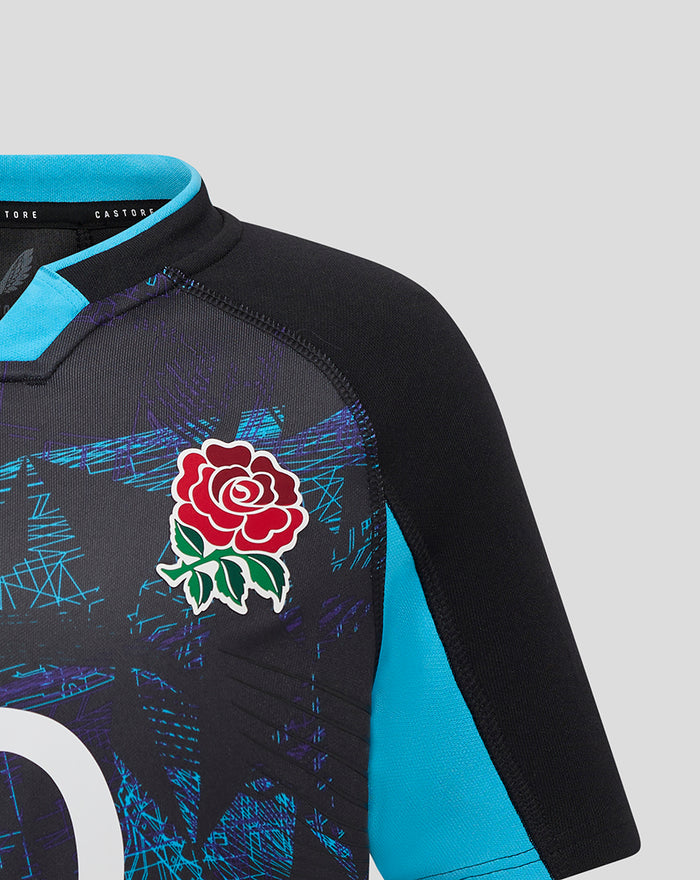 Close up of England Rugby junior alternate replica shirt showing red rose badge on black fabric with turquoise trim