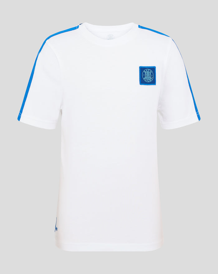 Front view of white junior T shirt with blue shoulder piping and Bath Rugby crest patch on the chest