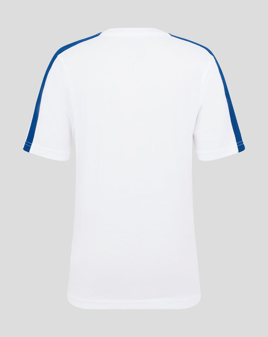 Rear view of white junior T shirt with blue piping along shoulders and sleeves