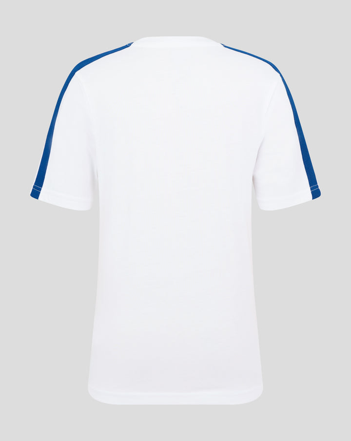 Rear view of white junior T shirt with blue piping along shoulders and sleeves