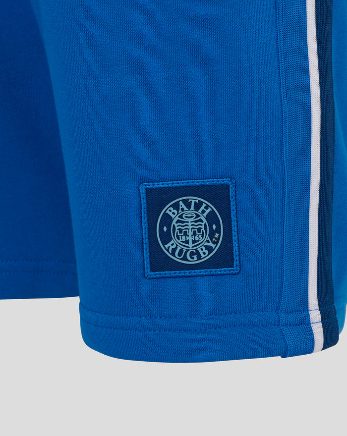Blue junior classic shorts showing a back pocket with flap and a white side stripe along the leg