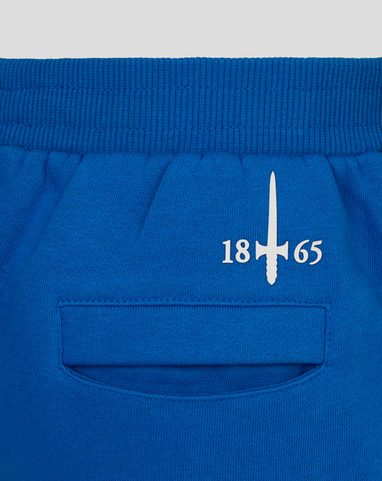 Blue Junior 24/25 Classic Short waistband close-up showing elastic and curved pocket edge.