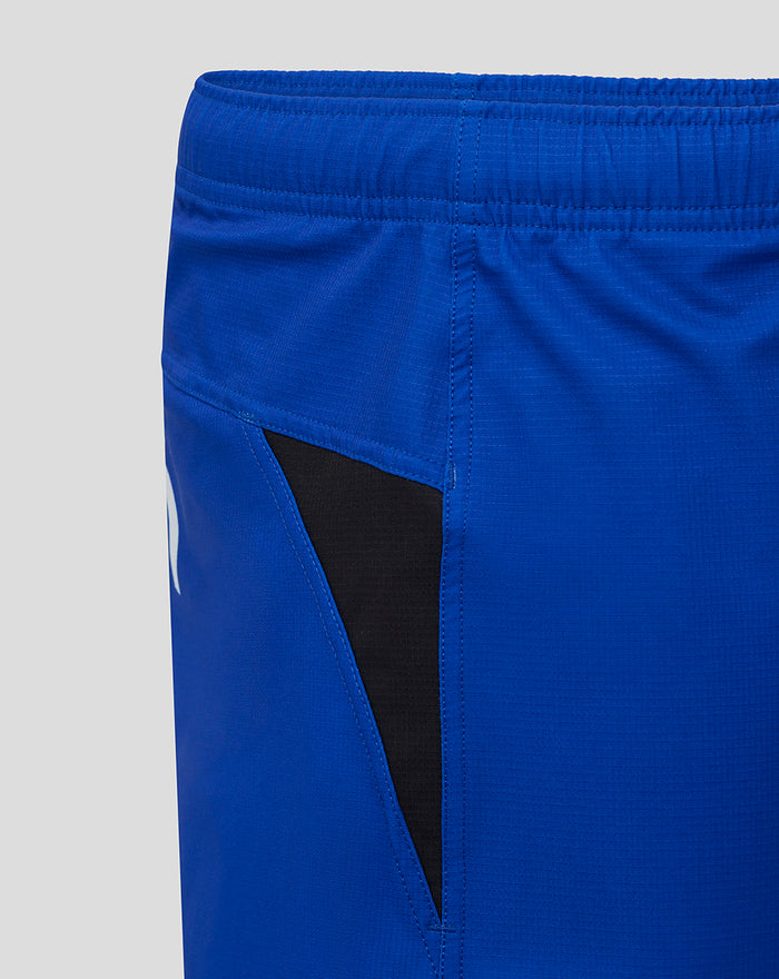 Close-up of side seam with black panel insert on royal blue Bath Rugby shorts.