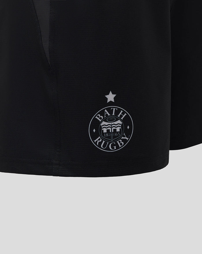 Close-up of black Bath Rugby Pro Shorts showing the Bath Rugby crest on the left leg and Castore logo on the right