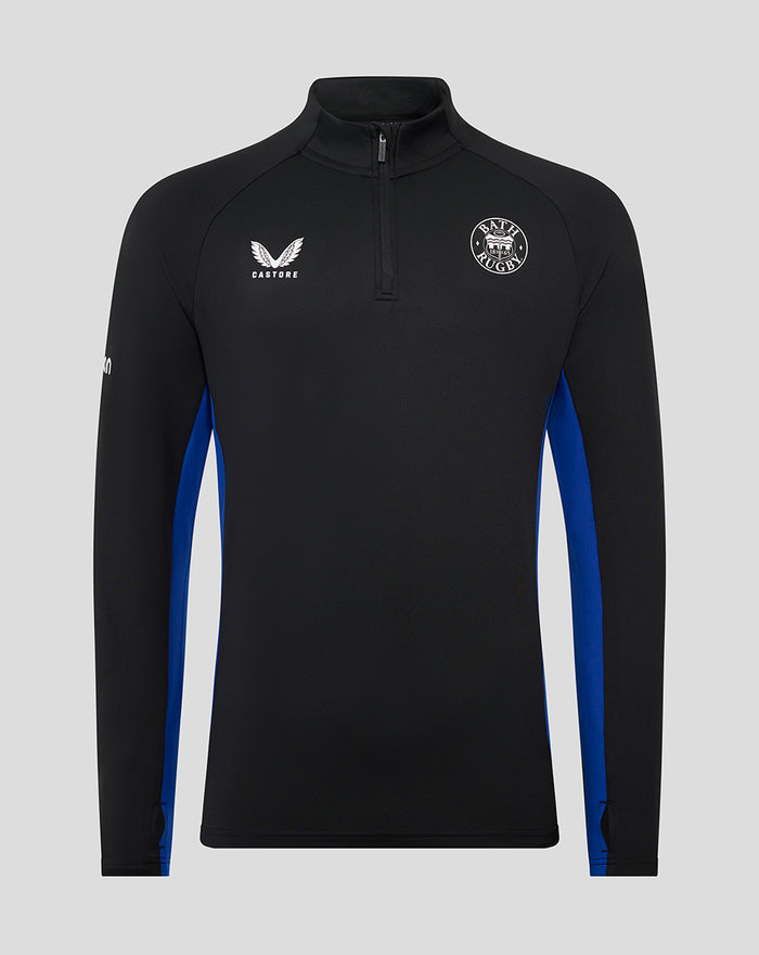 Front view of junior Bath Rugby training midlayer top in black with blue side panels and quarter zip, Bath Rugby crest.