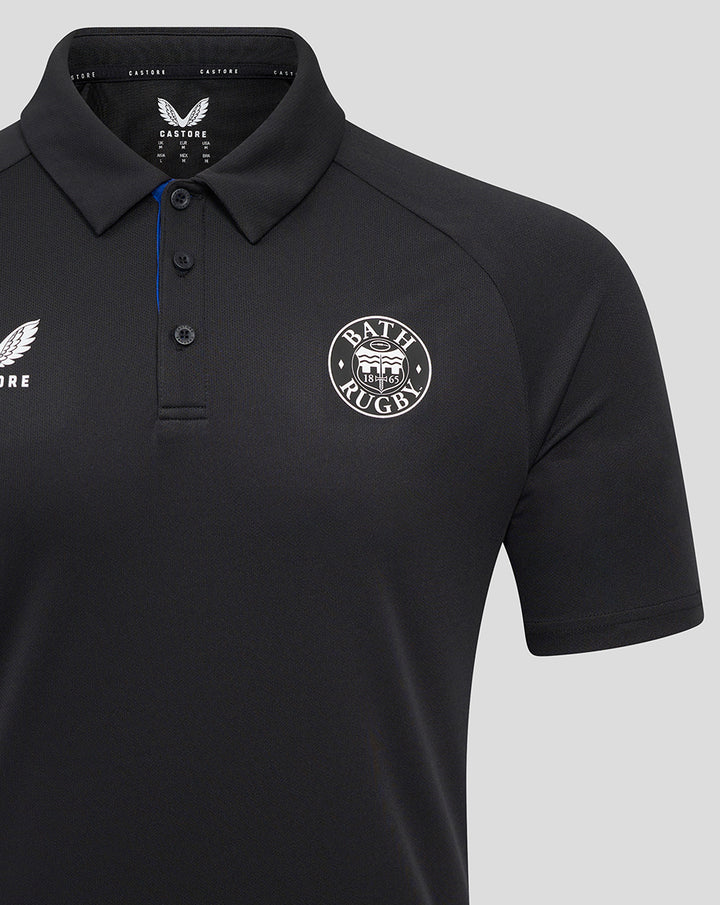 Bath Rugby Poly Polo close up with circular crest badge on the chest against dark fabric.
