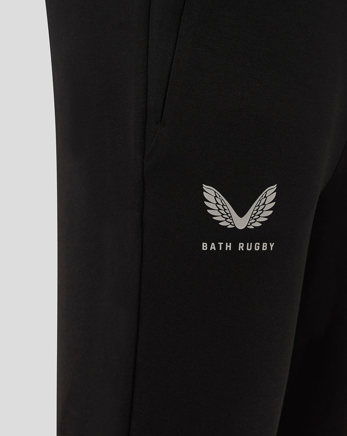 Close up of black Bath Rugby pant leg showing the silver wings logo and Bath Rugby branding.