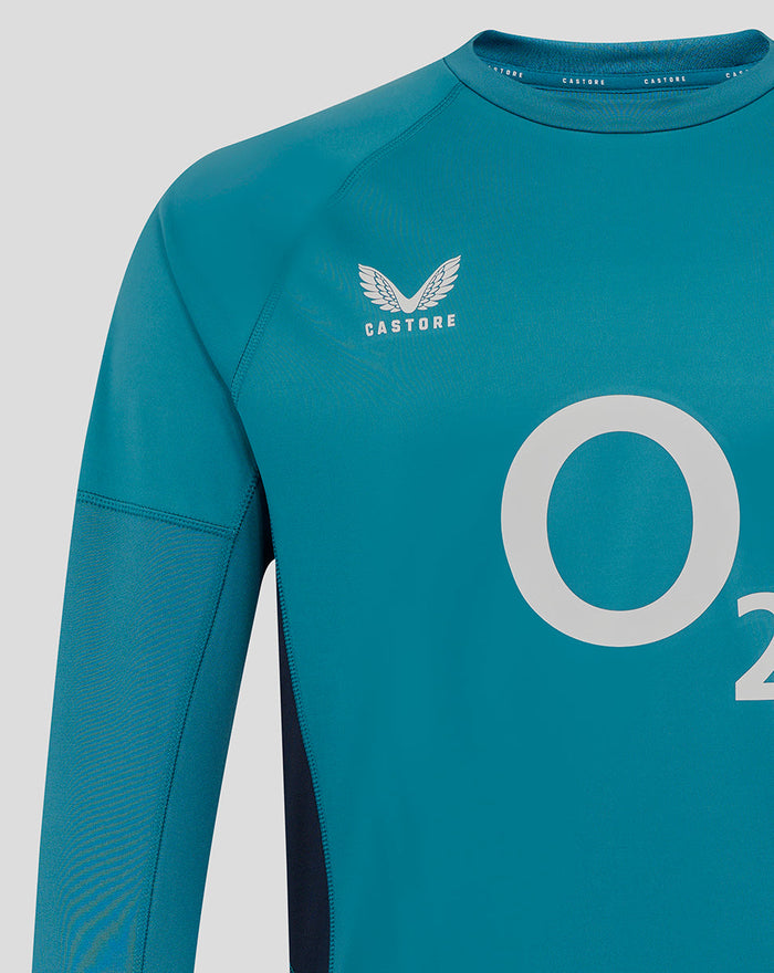 Close-up of teal rugby top chest featuring Castore logo and large O2 sponsor.